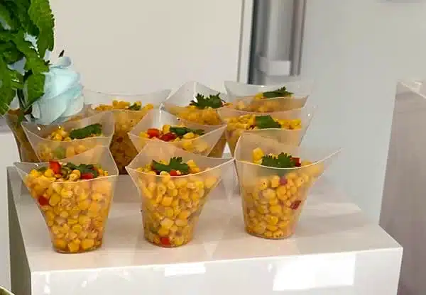 Masala corn salad cups topped with coriander